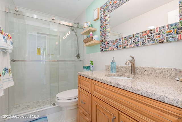 303 Winslow Cir, Cocoa Beach, FL 32931 - full bathroom with toilet, vanity, and a shower stall