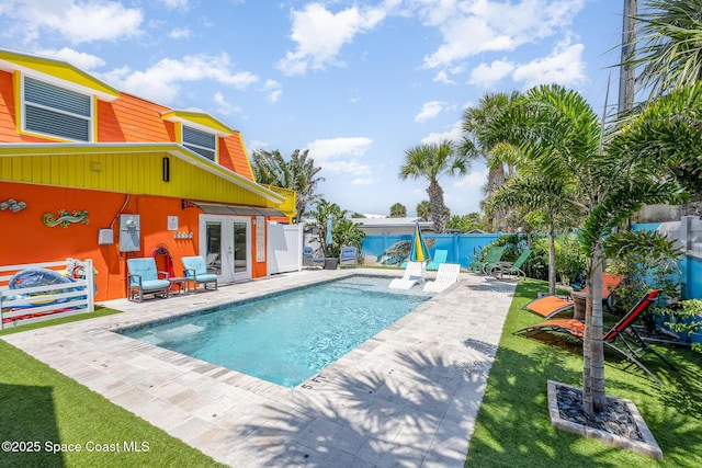 303 Winslow Cir, Cocoa Beach, FL 32931 - view of pool featuring french doors, a fenced backyard, and a patio area