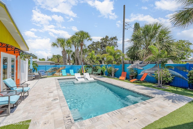 303 Winslow Cir, Cocoa Beach, FL 32931 - view of swimming pool with french doors, a fenced backyard, and a patio area