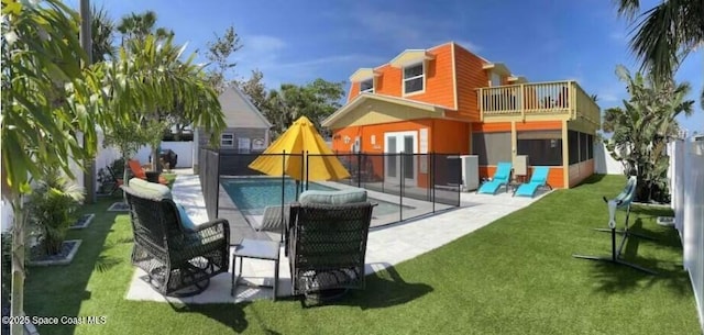 303 Winslow Cir, Cocoa Beach, FL 32931 - rear view of house with a balcony, a patio, french doors, and stucco siding