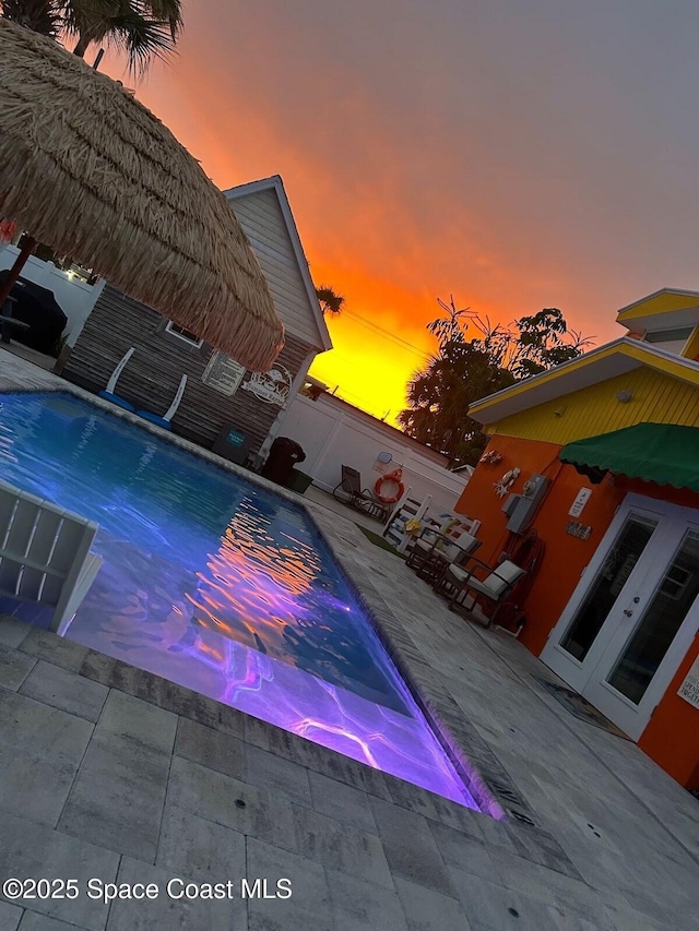 303 Winslow Cir, Cocoa Beach, FL 32931 - view of swimming pool featuring a patio