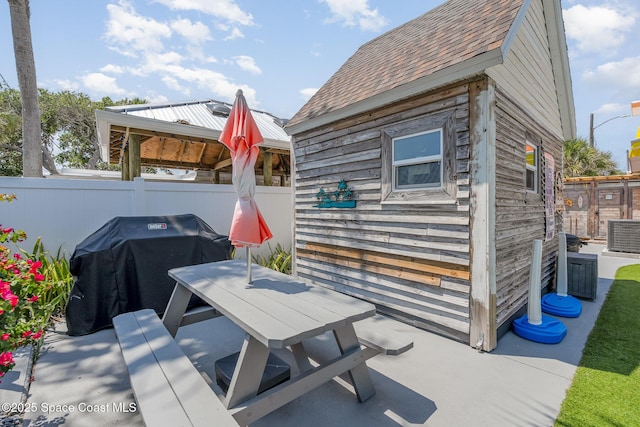 303 Winslow Cir, Cocoa Beach, FL 32931 - view of patio / terrace featuring outdoor dining area, a gazebo, and grilling area