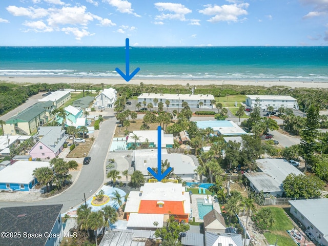 303 Winslow Cir, Cocoa Beach, FL 32931 - bird's eye view of waterfront with a beach