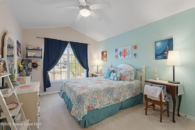 401 Trotter Ln Unit 202, Melbourne, FL 32940 - bedroom with light carpet, baseboards, vaulted ceiling, and a ceiling fan