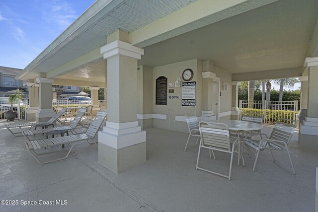 401 Trotter Ln Unit 202, Melbourne, FL 32940 - view of patio with fence and outdoor dining space
