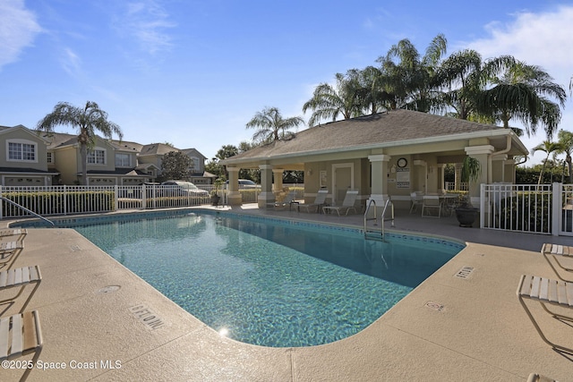 401 Trotter Ln Unit 202, Melbourne, FL 32940 - community pool featuring a patio area and fence