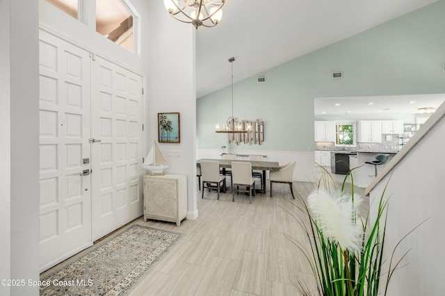 4070 S Tropical Trl, Merritt Island, FL 32952 - foyer with a chandelier and high vaulted ceiling