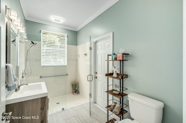 4070 S Tropical Trl, Merritt Island, FL 32952 - bathroom featuring tiled shower, toilet, ornamental molding, and vanity