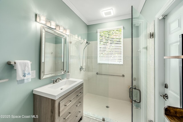 4070 S Tropical Trl, Merritt Island, FL 32952 - bathroom with a stall shower, crown molding, and vanity