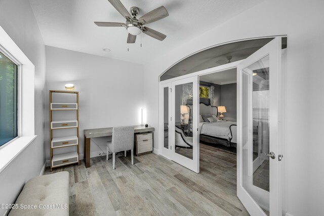 4070 S Tropical Trl, Merritt Island, FL 32952 - office with french doors, wood finished floors, ceiling fan, and baseboards