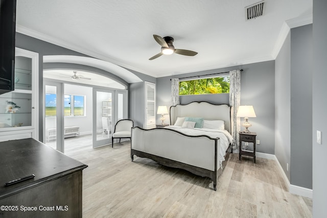 4070 S Tropical Trl, Merritt Island, FL 32952 - bedroom with light wood-style floors, baseboards, crown molding, and a ceiling fan