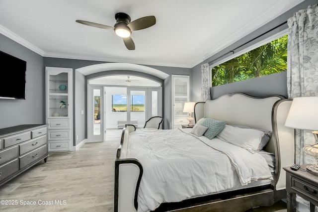 4070 S Tropical Trl, Merritt Island, FL 32952 - bedroom featuring light wood finished floors, ornamental molding, multiple windows, access to outside, and a ceiling fan
