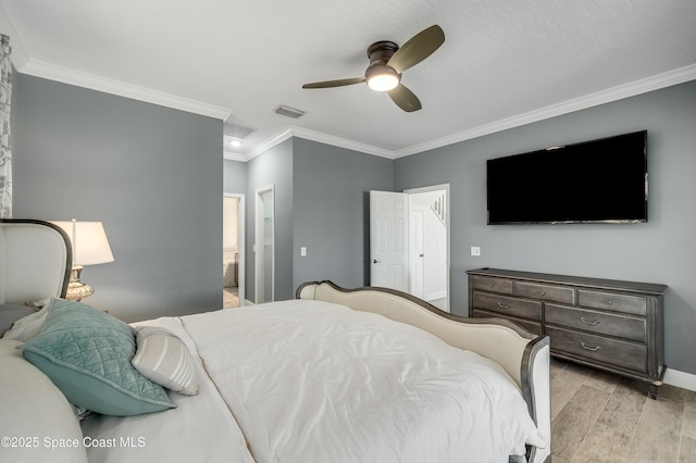 4070 S Tropical Trl, Merritt Island, FL 32952 - bedroom with light wood-style floors, crown molding, baseboards, ensuite bathroom, and ceiling fan