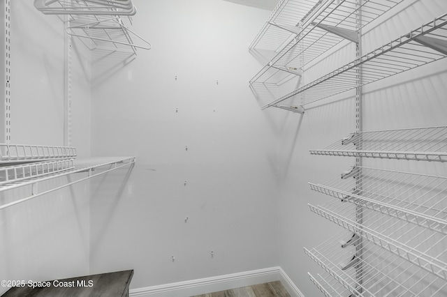 4070 S Tropical Trl, Merritt Island, FL 32952 - spacious closet with wood finished floors