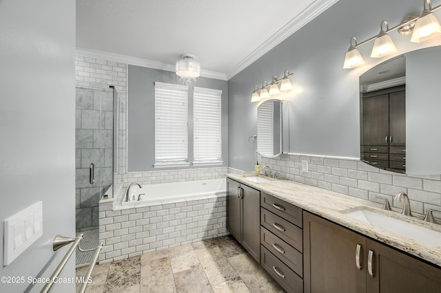 4070 S Tropical Trl, Merritt Island, FL 32952 - bathroom with a garden tub, a shower stall, double vanity, and crown molding