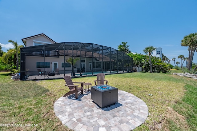 4070 S Tropical Trl, Merritt Island, FL 32952 - view of green lawn featuring a patio area, an outdoor fire pit, a swimming pool, and a lanai