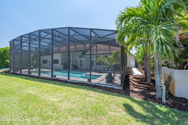 4070 S Tropical Trl, Merritt Island, FL 32952 - outdoor pool with a lawn, a patio, and glass enclosure
