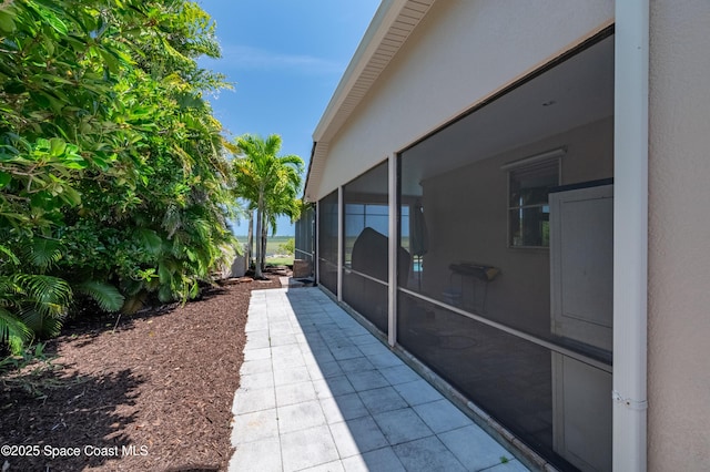 4070 S Tropical Trl, Merritt Island, FL 32952 - view of patio with a sunroom