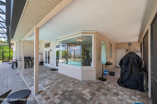 4070 S Tropical Trl, Merritt Island, FL 32952 - view of patio featuring french doors and a lanai
