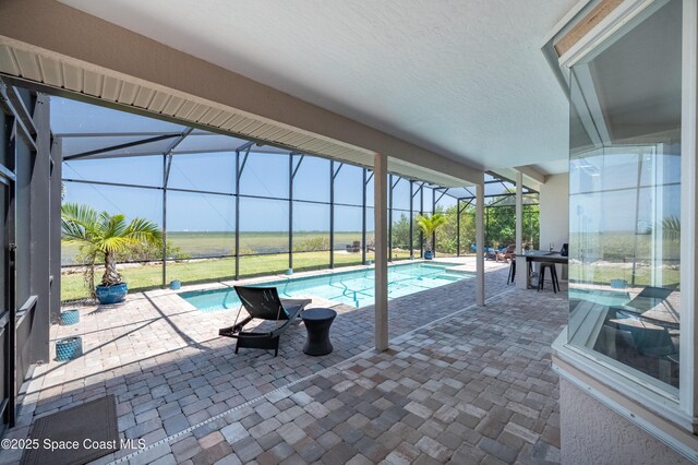 4070 S Tropical Trl, Merritt Island, FL 32952 - swimming pool with a lanai and a patio