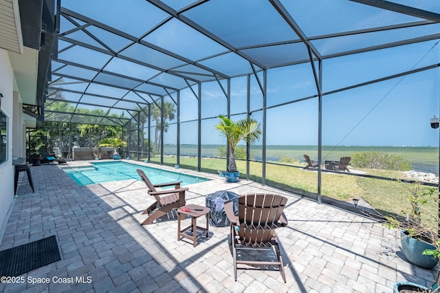 4070 S Tropical Trl, Merritt Island, FL 32952 - outdoor pool featuring glass enclosure and a patio