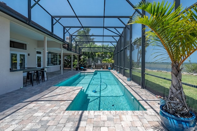 4070 S Tropical Trl, Merritt Island, FL 32952 - swimming pool with a patio and glass enclosure
