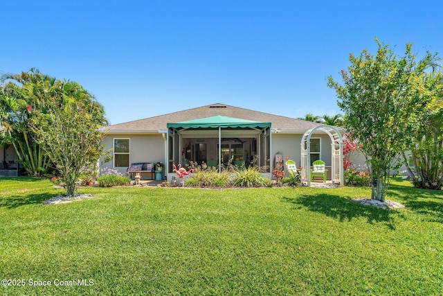 439 Briarcliff Cir, Sebastian, FL 32958 - back of house featuring a yard, stucco siding, and a sunroom