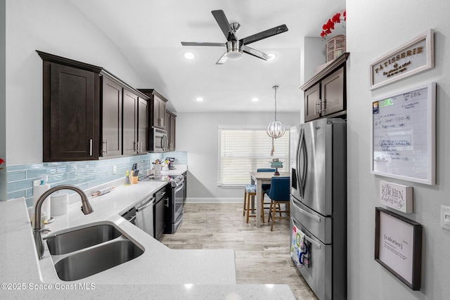 439 Briarcliff Cir, Sebastian, FL 32958 - kitchen featuring stainless steel appliances, a sink, dark brown cabinets, a ceiling fan, and recessed lighting