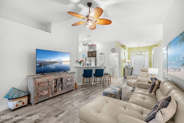 439 Briarcliff Cir, Sebastian, FL 32958 - living area featuring a ceiling fan, light wood-type flooring, and baseboards