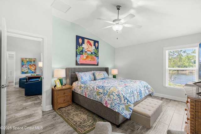 439 Briarcliff Cir, Sebastian, FL 32958 - bedroom featuring wood finished floors, lofted ceiling, baseboards, and ceiling fan