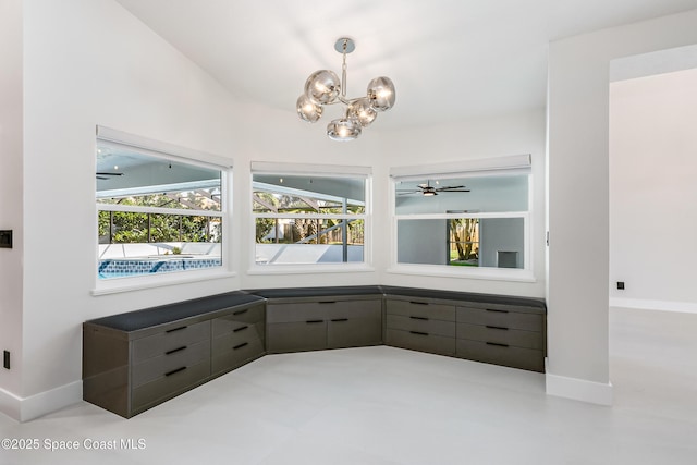 100 Martesia Way, Indian Harbour Beach, FL 32937 - interior space with a chandelier, baseboards, and a ceiling fan