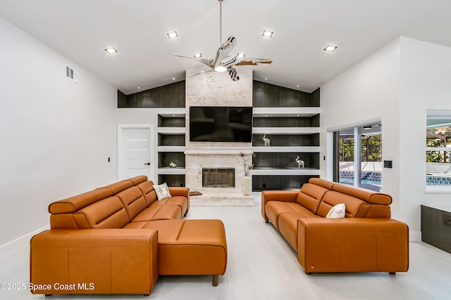 100 Martesia Way, Indian Harbour Beach, FL 32937 - living area featuring high vaulted ceiling, built in shelves, a ceiling fan, a high end fireplace, and baseboards