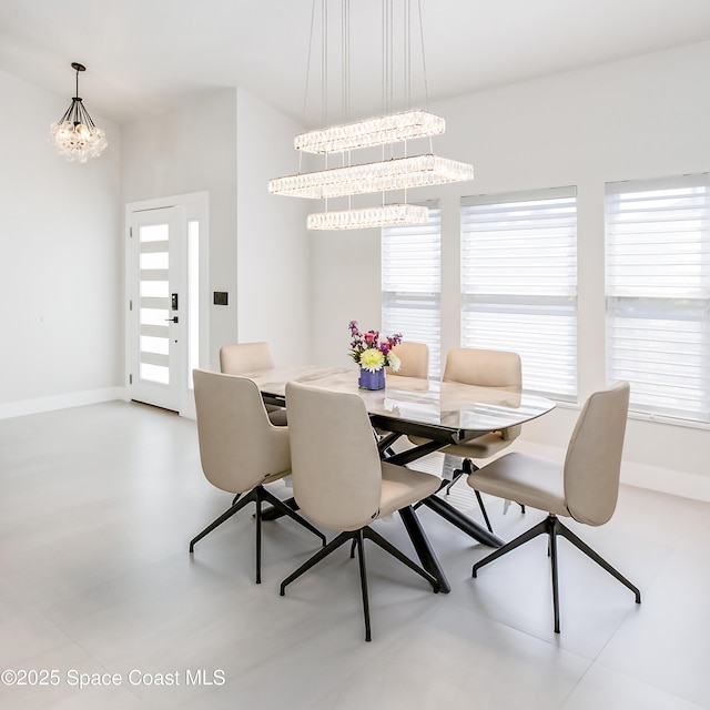 100 Martesia Way, Indian Harbour Beach, FL 32937 - dining area with a chandelier and baseboards