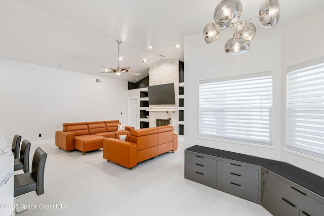 100 Martesia Way, Indian Harbour Beach, FL 32937 - living area featuring a ceiling fan, lofted ceiling, plenty of natural light, a fireplace, and built in shelves