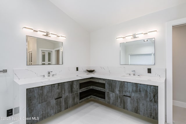 100 Martesia Way, Indian Harbour Beach, FL 32937 - bathroom with double vanity and lofted ceiling