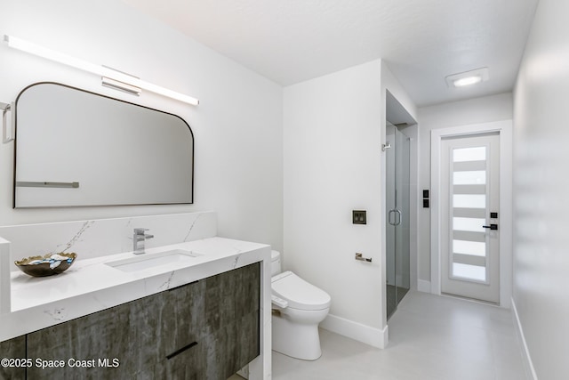 100 Martesia Way, Indian Harbour Beach, FL 32937 - full bath featuring toilet, vanity, baseboards, and a stall shower
