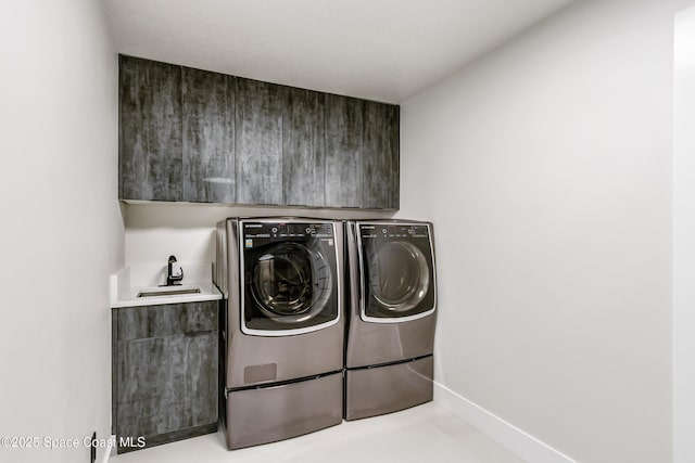 100 Martesia Way, Indian Harbour Beach, FL 32937 - washroom featuring washing machine and clothes dryer and cabinet space
