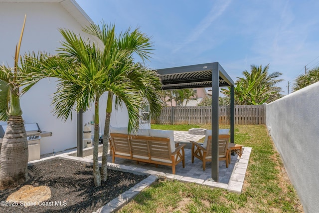 100 Martesia Way, Indian Harbour Beach, FL 32937 - fenced backyard featuring a patio area and an outdoor living space