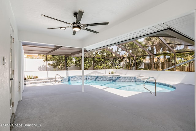 100 Martesia Way, Indian Harbour Beach, FL 32937 - view of swimming pool featuring a fenced backyard, ceiling fan, a patio area, a pool with connected hot tub, and a lanai
