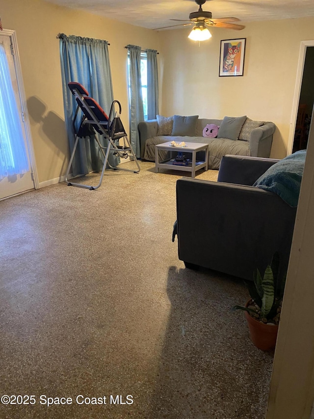 living room featuring ceiling fan