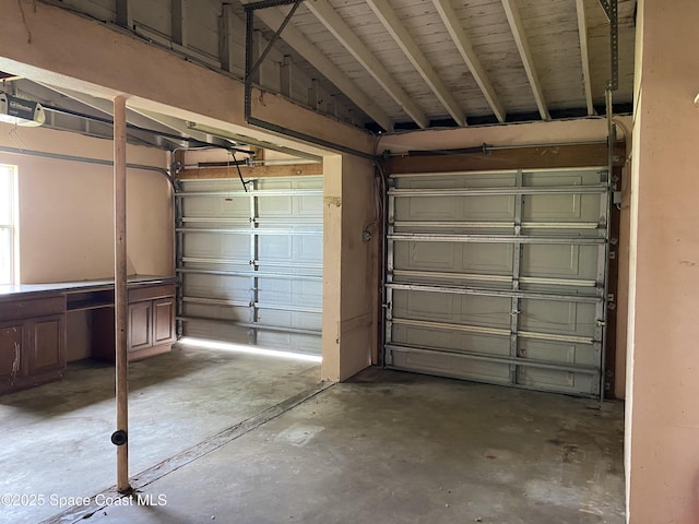 701 Lund Cir, Melbourne, FL 32901 - garage featuring a garage door opener