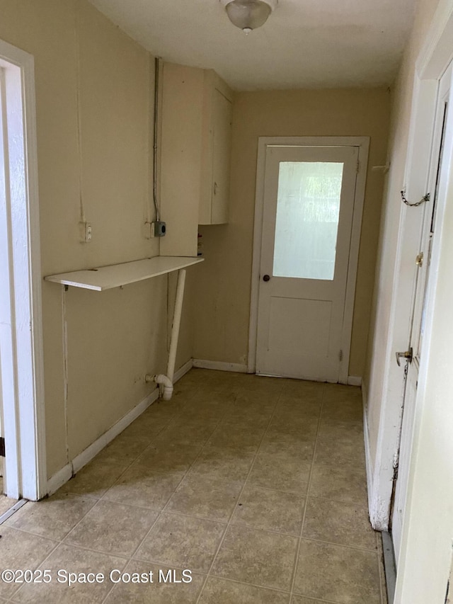 701 Lund Cir, Melbourne, FL 32901 - laundry room featuring light tile patterned floors