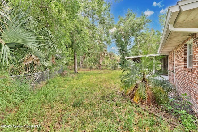 view of yard featuring fence
