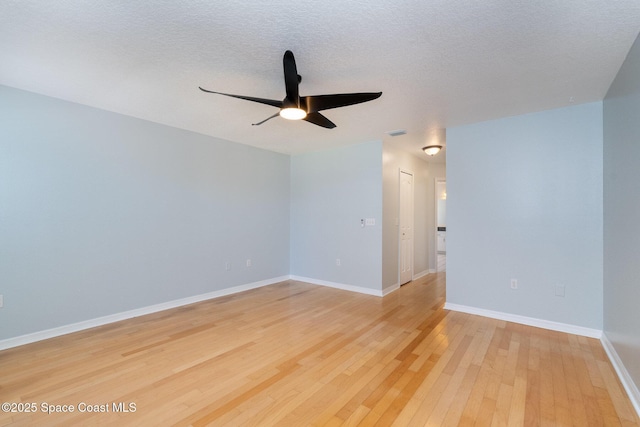 6860 Cedar Ave, Cocoa, FL 32927 - unfurnished room with ceiling fan, light wood-style flooring, baseboards, and a textured ceiling