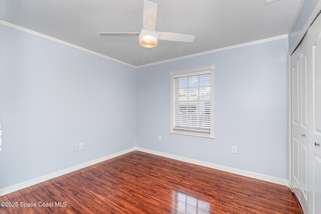 6860 Cedar Ave, Cocoa, FL 32927 - unfurnished bedroom featuring wood finished floors, a closet, baseboards, crown molding, and a ceiling fan