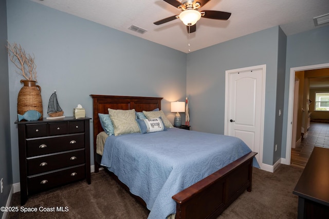 4407 Preservation Cir, Melbourne, FL 32934 - bedroom featuring dark colored carpet, baseboards, and a ceiling fan
