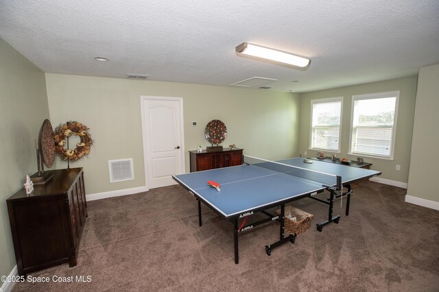 4407 Preservation Cir, Melbourne, FL 32934 - game room featuring a textured ceiling, carpet, and baseboards