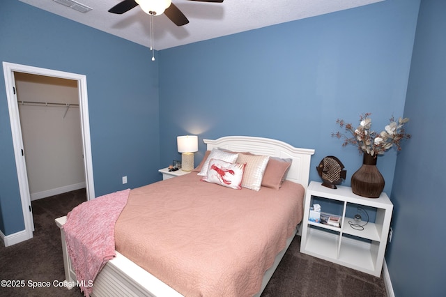 4407 Preservation Cir, Melbourne, FL 32934 - bedroom featuring carpet flooring, baseboards, a closet, a spacious closet, and ceiling fan