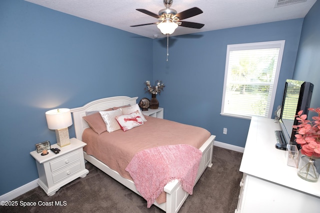 4407 Preservation Cir, Melbourne, FL 32934 - bedroom with dark colored carpet, baseboards, and ceiling fan