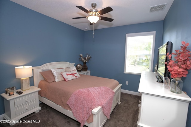 4407 Preservation Cir, Melbourne, FL 32934 - bedroom featuring dark colored carpet, baseboards, and ceiling fan